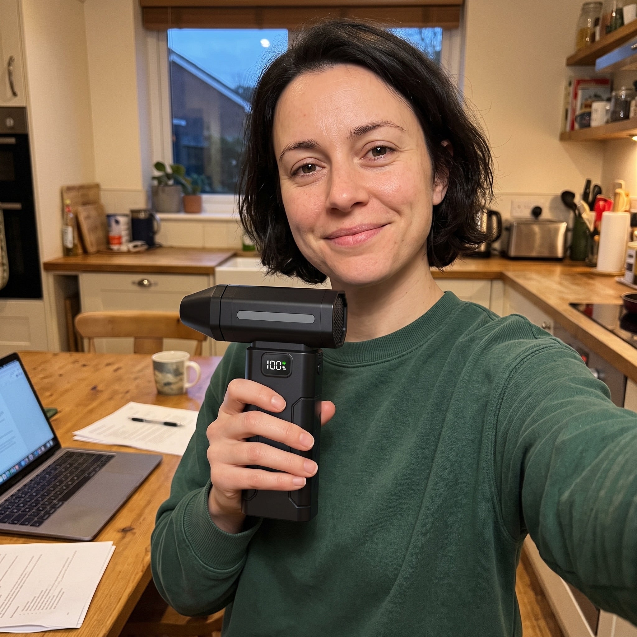 Black ClearJet handheld blower in an everyday dust-cleaning setting 6